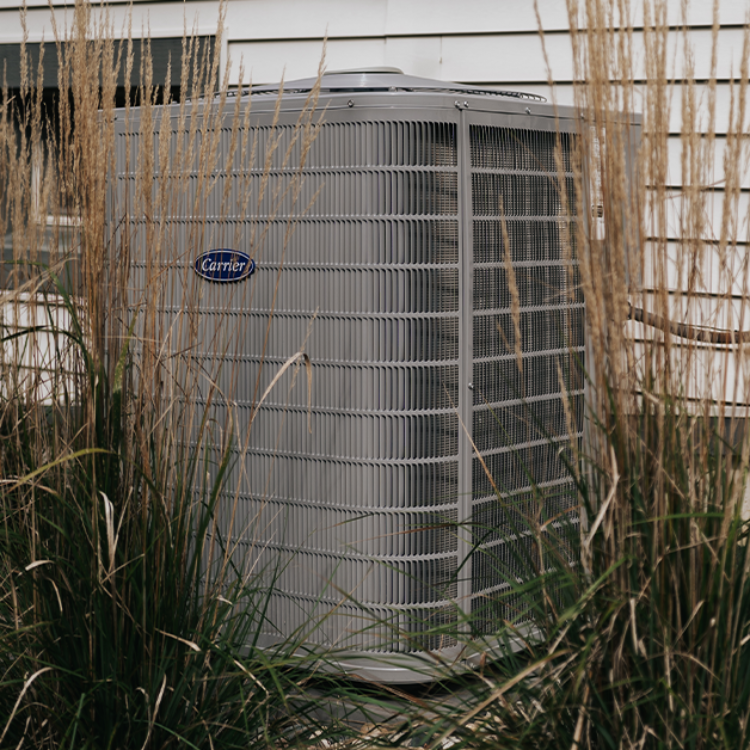 DUCTBUSTERS service technician performing multi-unit dryer vent service